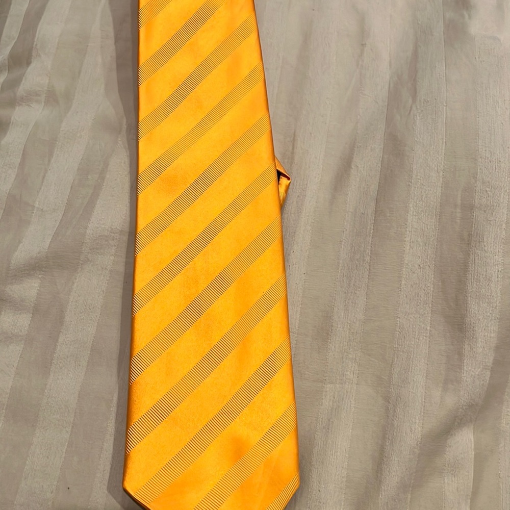 Barney’s tie made in Italy.   Silk  orange